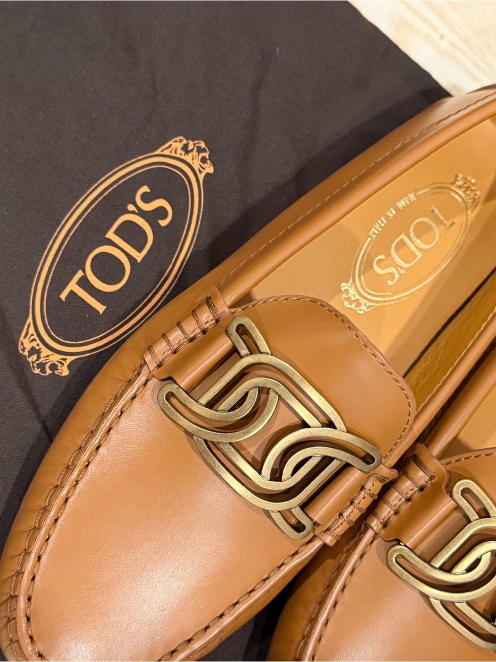 TOD'S Tan Leather Penny Loafers with Gold Tone Chain Accent